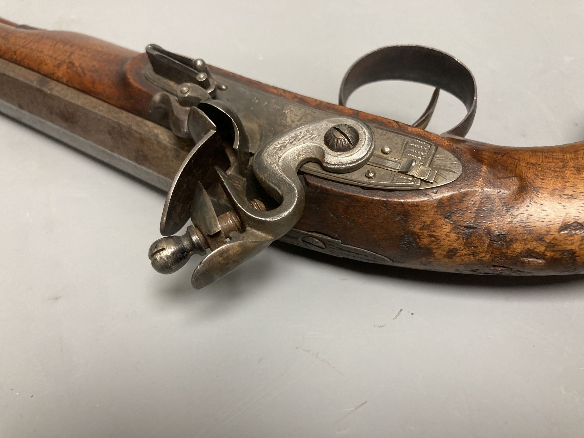 A 19th century octagonal barrelled flintlock pistol, lockplate engraved Twig